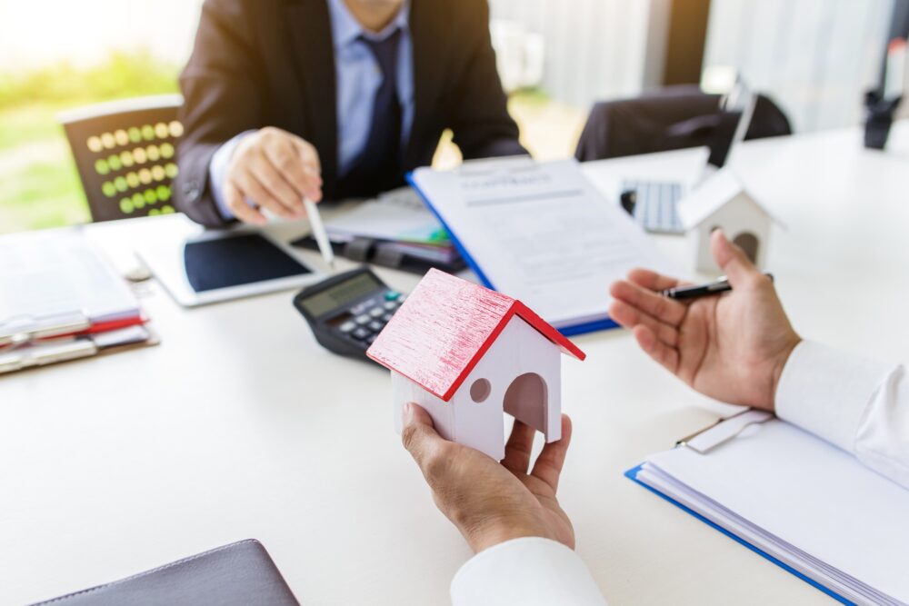 Business Signing a Contract Buy - sell house.